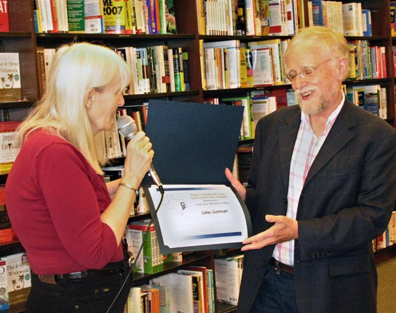 GCP President Mary Carlisle presents Dr. John
                    Gorman with a Lifetime Membership